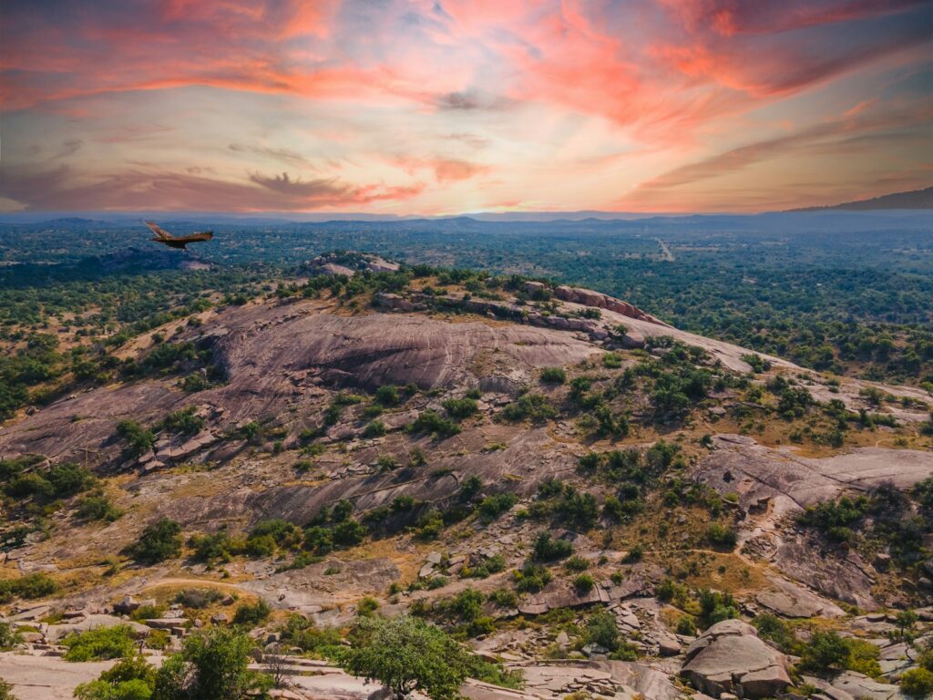 Aerial view of the granite dome at Enchanted Rock State Natural Area at sunset